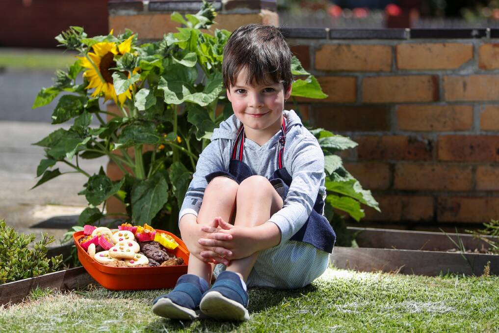 Arlie Edwards, 5, is baking cookies to raise money for the bushfires. Picture: Morgan Hancock