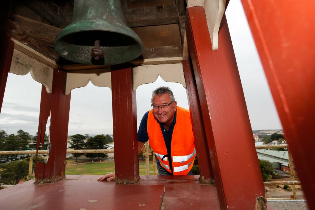 HISTORIC BELL: Principal Peter Auchettl checks out the bell in the tower at Warrnambool Primary School. Picture: Anthony Brady