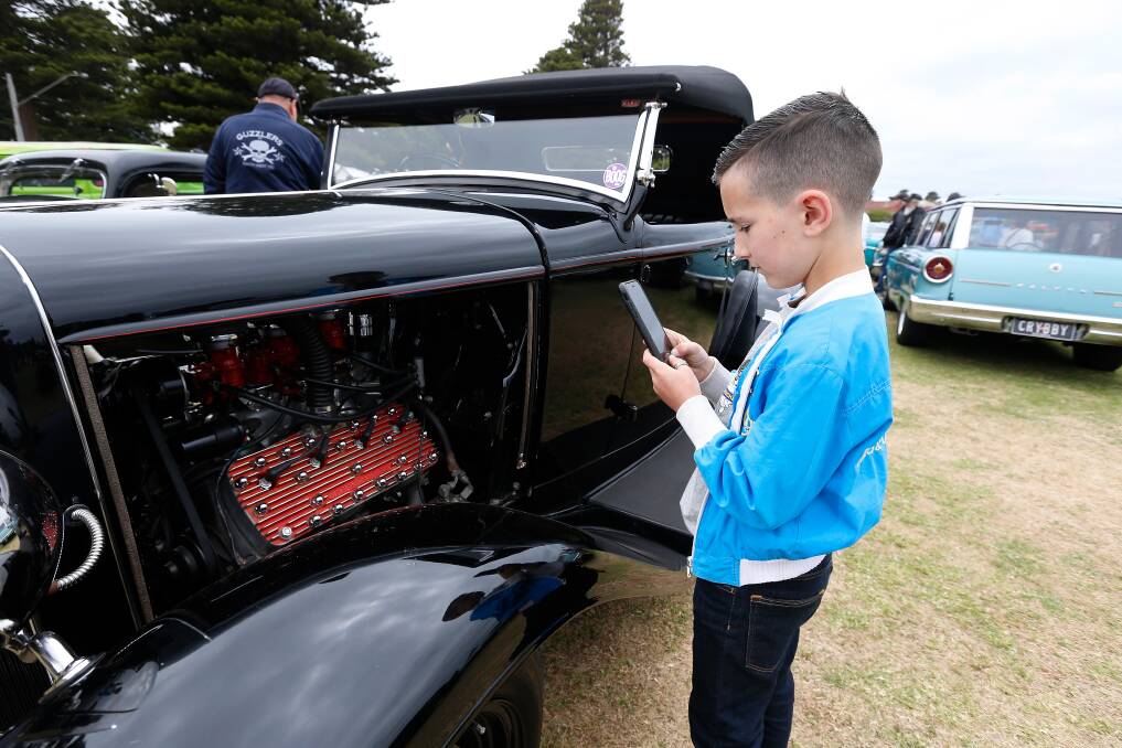 On show: Koroit's Spencer Allan, 9, takes a photo of one his favourite cars at the Hot Rod show. Picture: Mark Witte