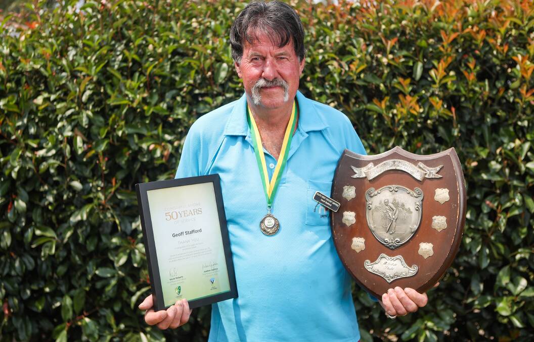 STANDARD, NEWS, CRICKET VETERAN HONOURED, 200114. Pictured: Geoff Stafford of Mortlake has been honoured with an award for his 50 years of service to cricket. He is pictured with the award (left) and a Hexham Cricket Club premiership shield. Picture: Morgan Hancock