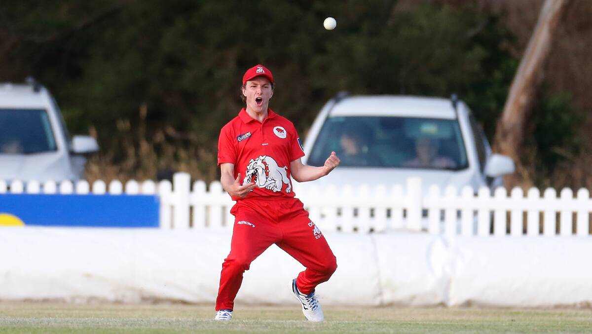 Dennington's Jack Noonan celebrates taking a catch in the outfield. Dustin Drew coached the Dogs to a Twenty20 final victory in this match. Picture: Mark Witte