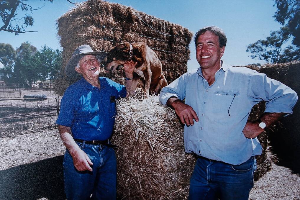 Helping hand: Max Anderson (right) with a Queensland farmer they donated hay to in the mid-90s. Picture: Anthony Brady
