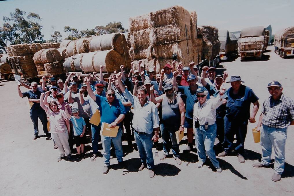 Hay drive: Max Anderson with the Timboon Lions Club hay run team from the mid-90s. Picture: Anthony Brady