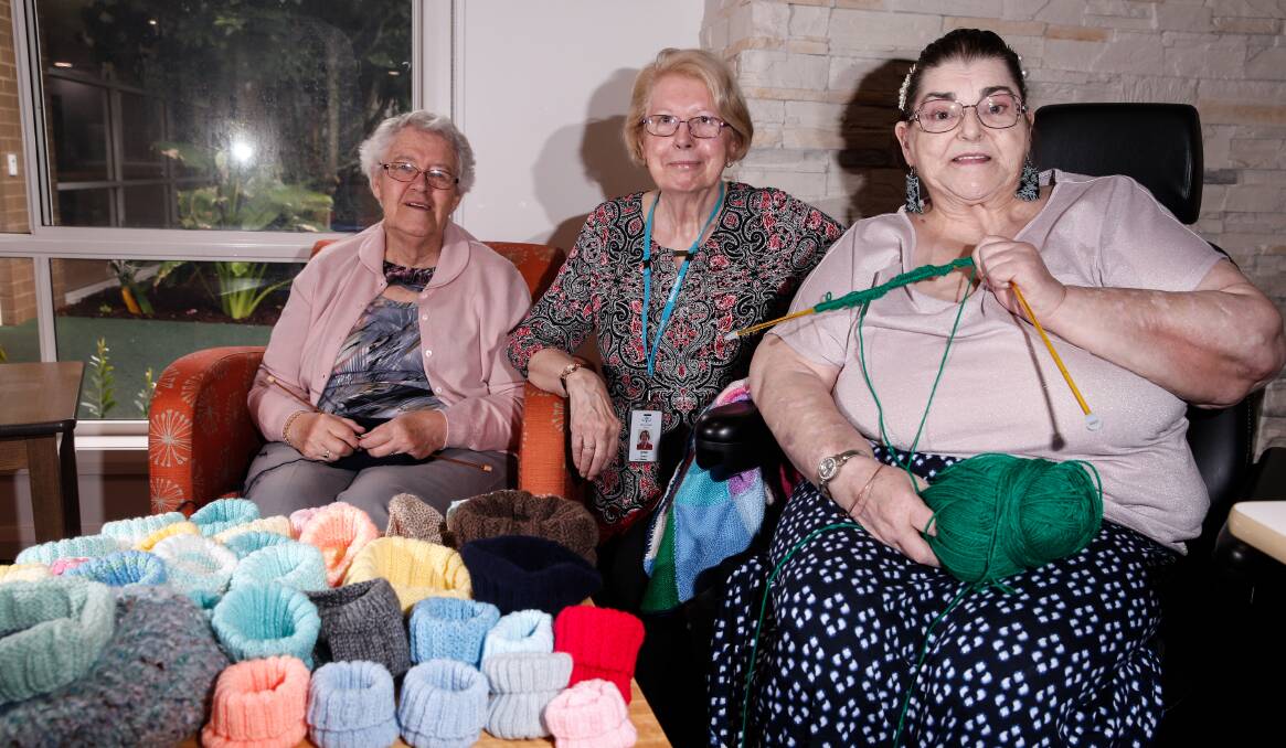 HELPING WILDLIFE: Mercy Place Warrnambool residents Yvonne Edey and Beverley Stewart with Volunteer Jenny Pearce (middle) are knitting for injured animals from the fires. Picture: Mark Witte