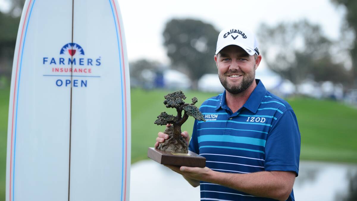 HAPPY DAYS: Marc Leishman poses with the Torrey Pines trophy after winning the Farmers Insurance Open at Torrey Pines. Picture: Donald Miralle/Getty Images