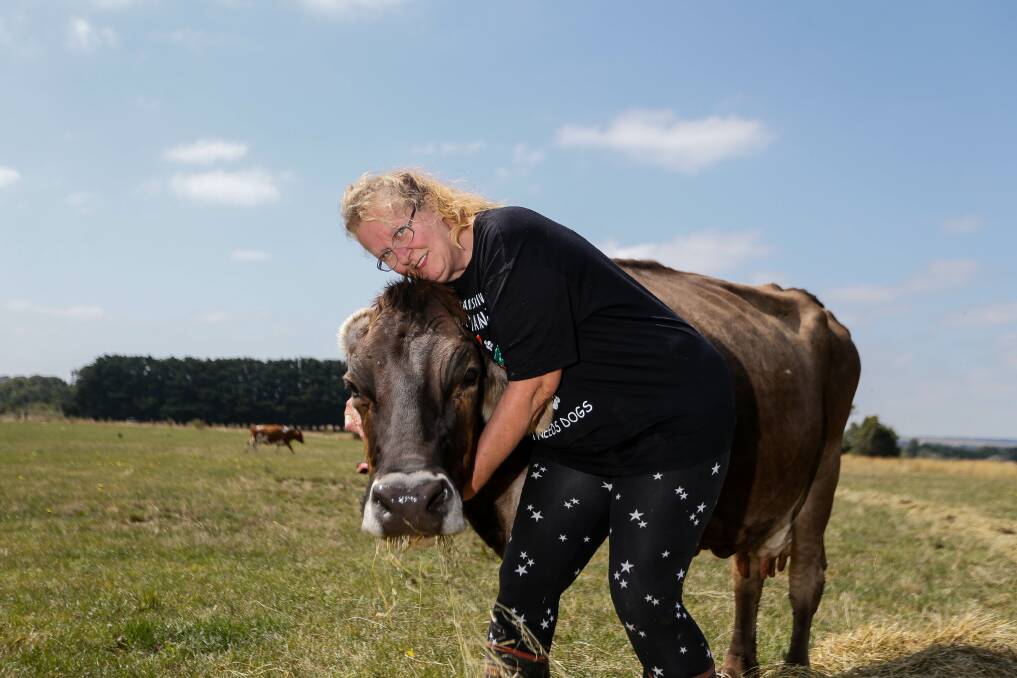 FAMILY: Gaylene Childs snuggles with one of her favourite cows on the farm. Pictures: Anthony Brady