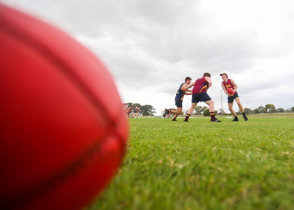 TIMEOUT: Players participate in a drill. Football and netball might not be played till June. Picture: Morgan Hancock