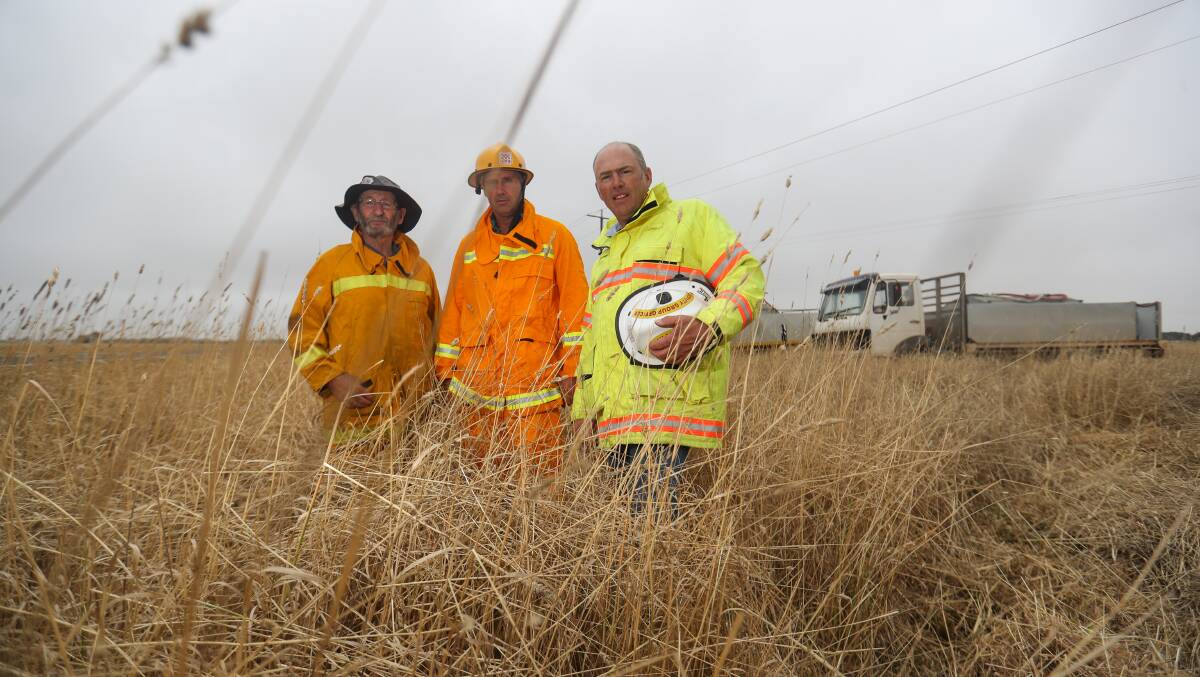 SHOCKED: Caramut CFA volunteers Geoff Howley, Aaron Pascoe and Bobby Mann gave up their time for the roadside burn. Picture: Morgan Hancock