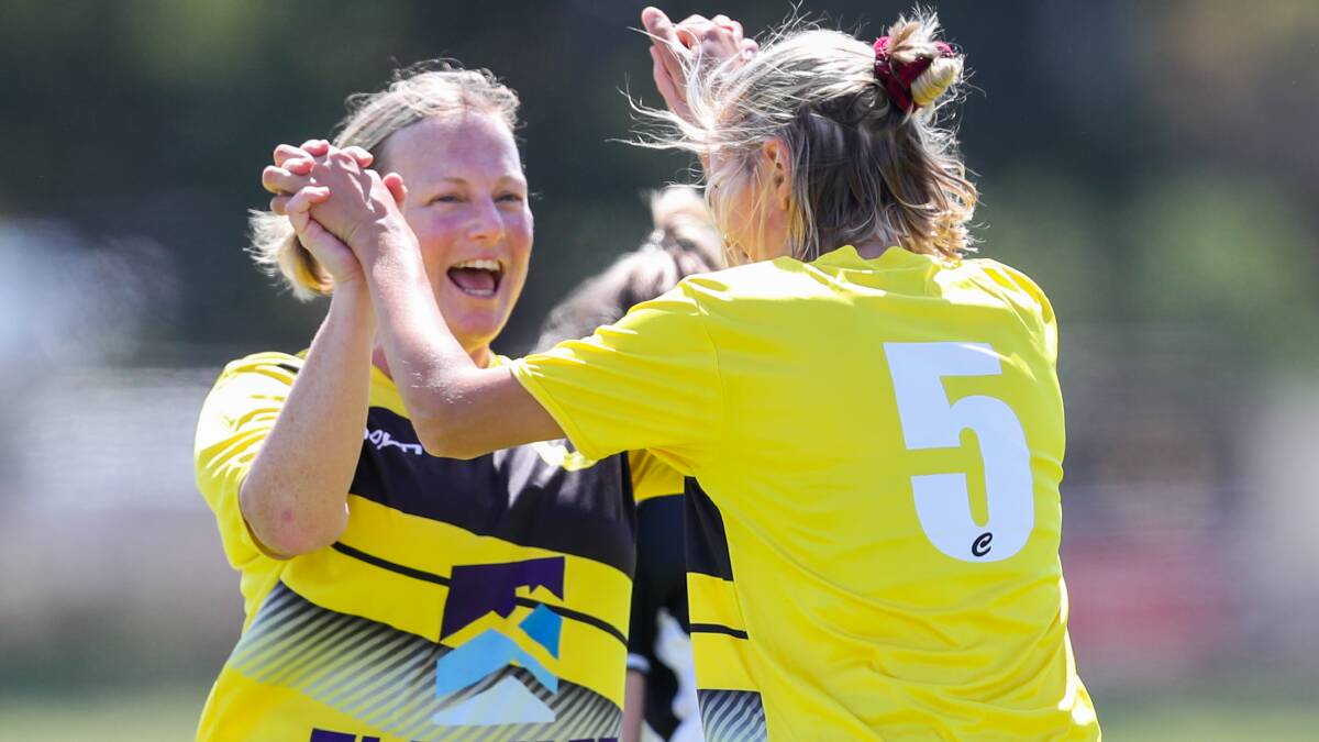 TEAMMATE PRIDE: Bonnie Lucas and Sofia Arvidsson celebrate a goal. Teammates will be able to share many more moments like this once sport resumes. Picture: Morgan Hancock