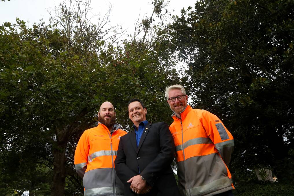 SOLUTION NEEDED: Animal Justice Party MP Andy Meddick (centre) with Warrnambool City Council employees Luke Coughlan and John Sheely at the botanic gardens. Picture: Morgan Hancock