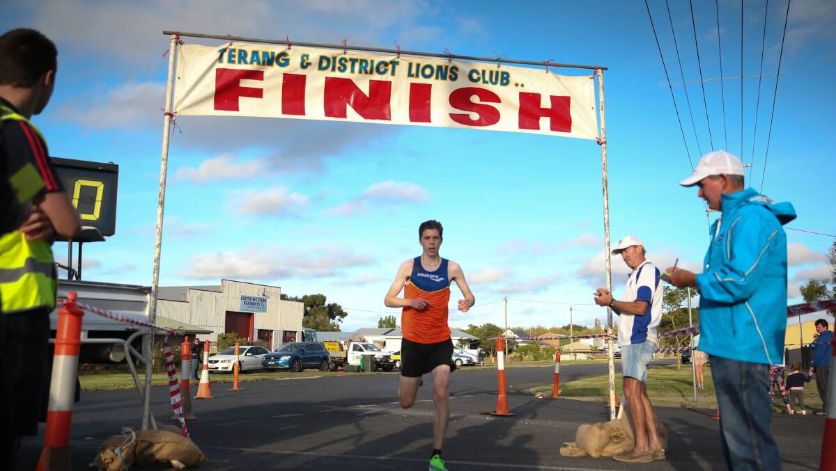 Strong finish: Warrnambool's Tom Hynes crosses the finish line in first place in a time of 18.20 minutes at the Terang fun run. Picture: Mark Witte