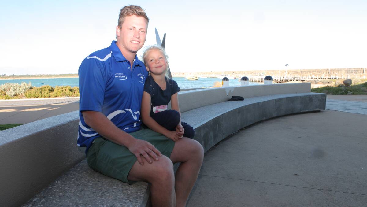HOMECOMING: Russells Creek recruit Dylan Herbertson with daughter Layla. Herbertson has returned to Mack Oval after a stint at Port Fairy. Picture: Nick Ansell