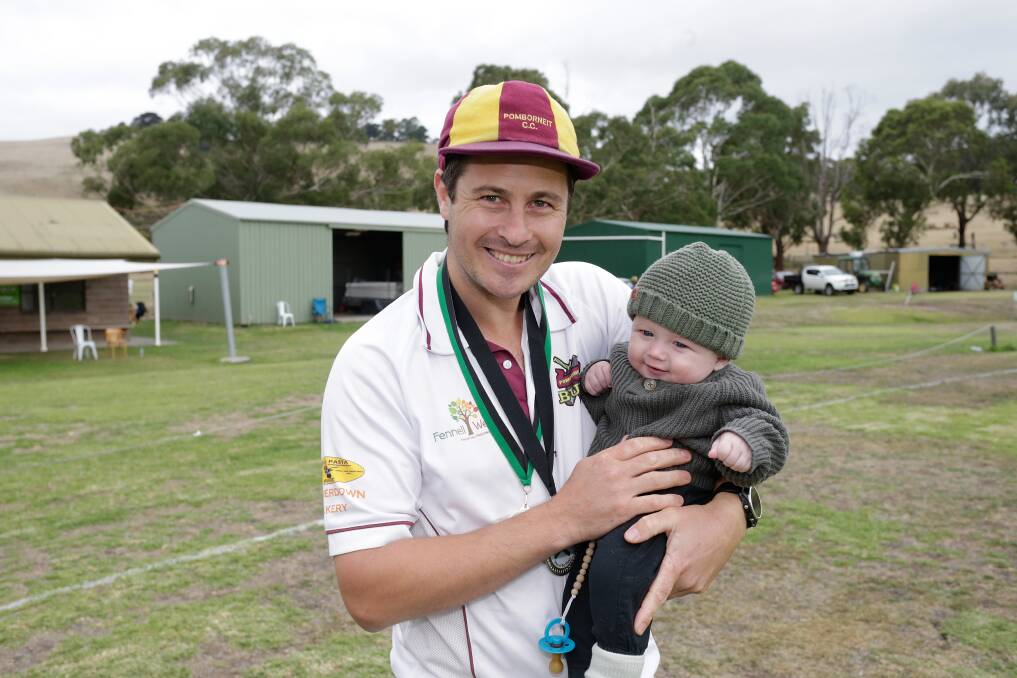 PROUD: Pomborneit's Clinton Place enjoyed having son William, five months, at the grand final. Place was player of the match. Picture: Mark Witte
