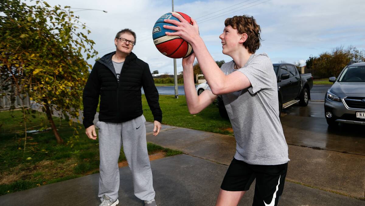 HOME COURT: Michael and Harry McGorm will have to continue to practicing at home. Picture: Anthony Brady