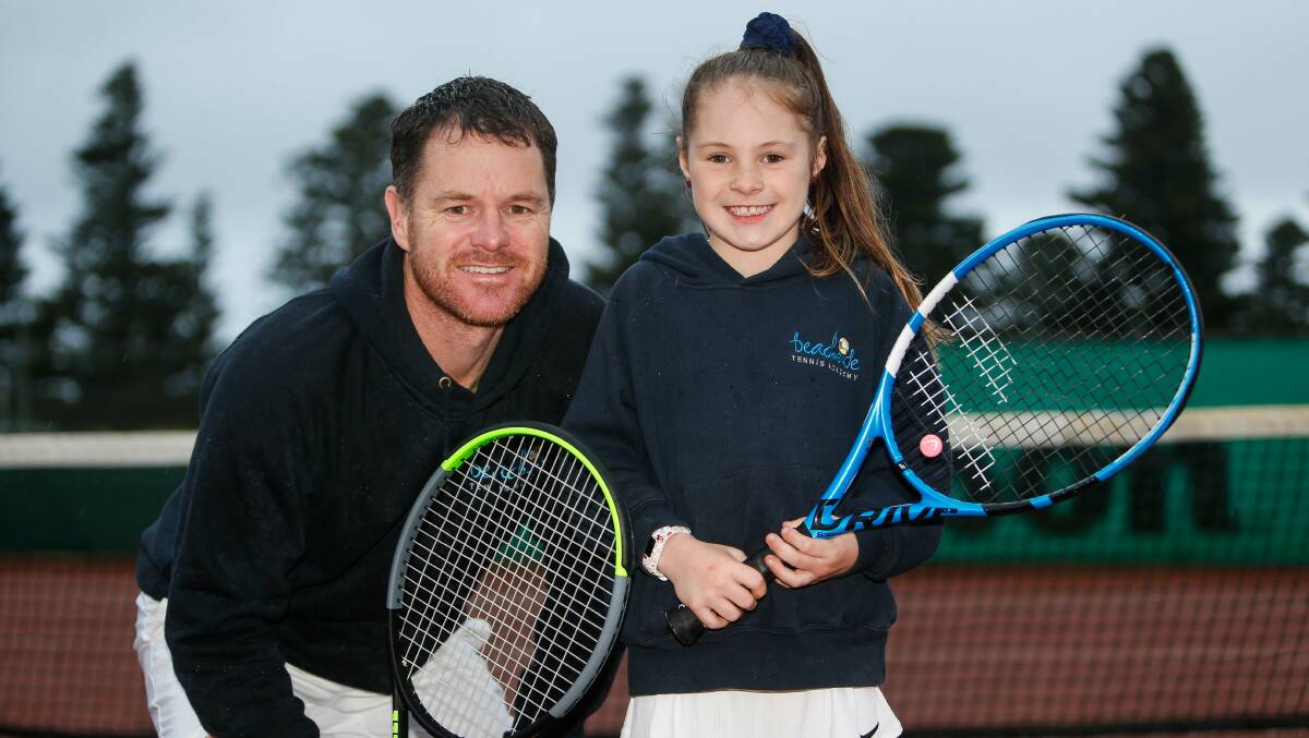 Group lessons are back: Coach Andrew Crawford and daughter Lilly from Beachside Tennis Academy. Picture: Anthony Brady