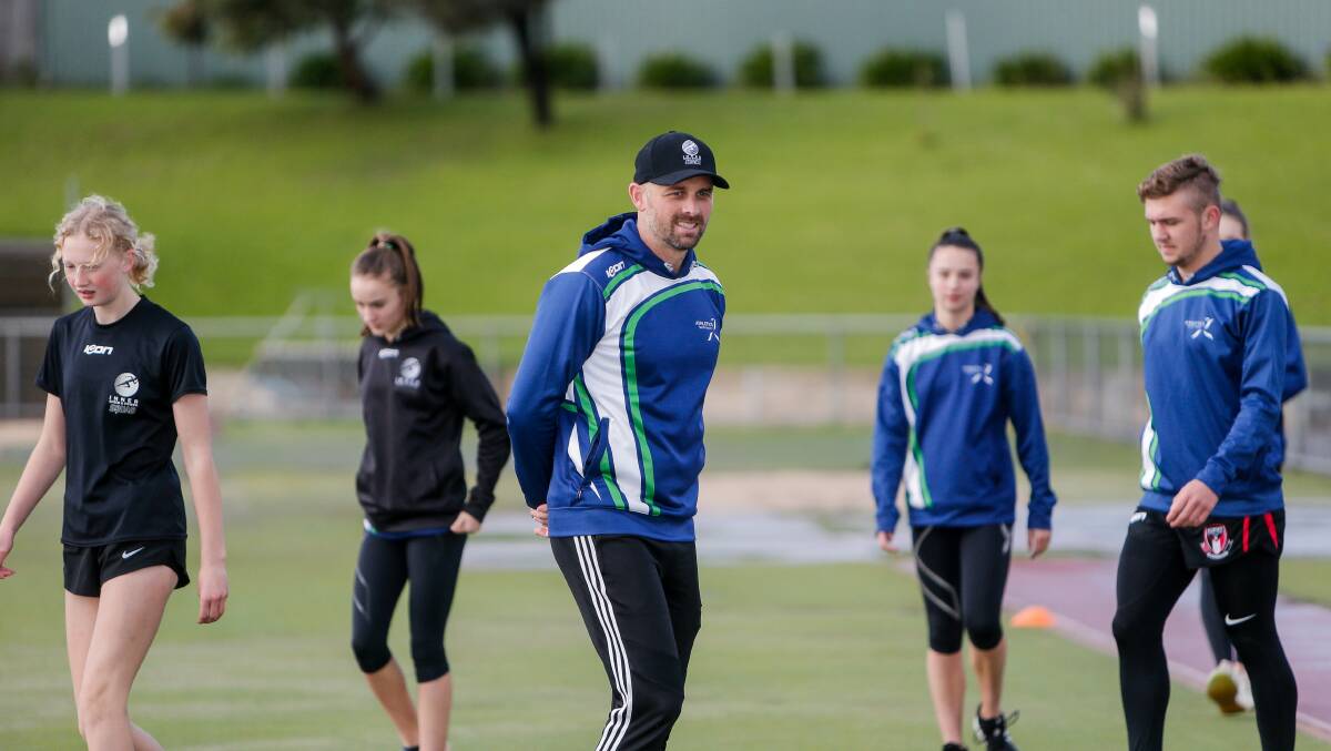 SQUAD: Jeremy Dixon watching over his Athletics South West Turbines members at training. Picture: Anthony Brady