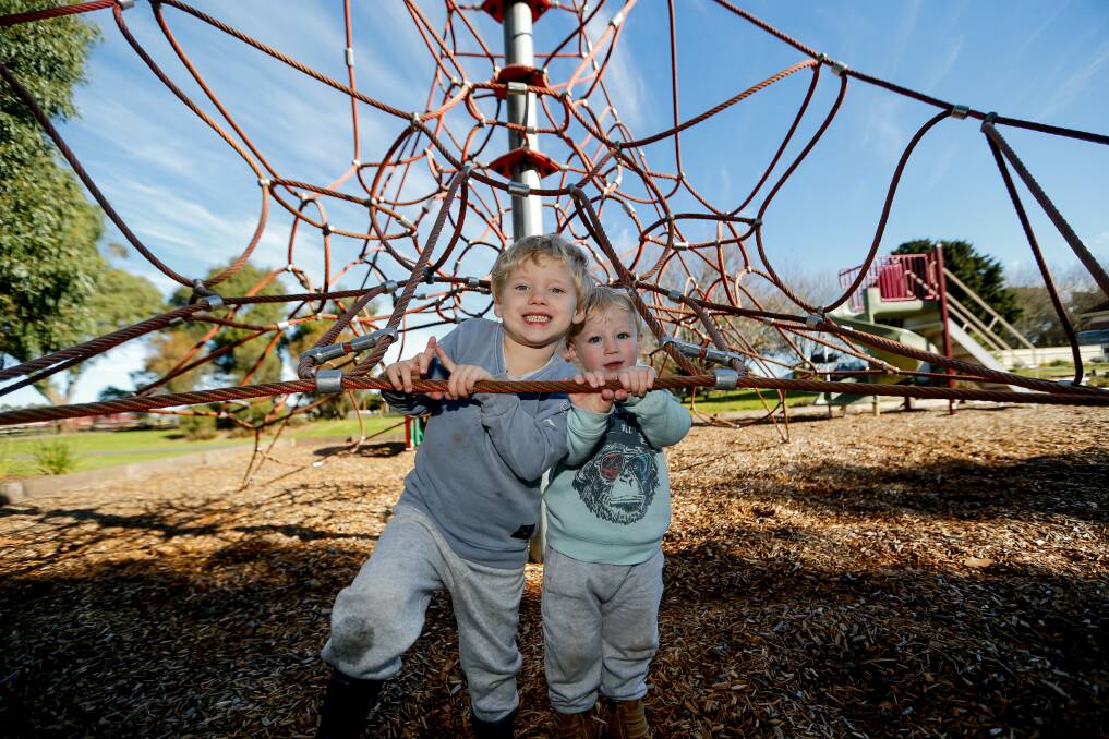 ALL SMILES: Edward and Ryan Glover didn't want to leave the Koroit Railway Station playground after it reopened to the public on Tuesday. Picture: Anthony Brady