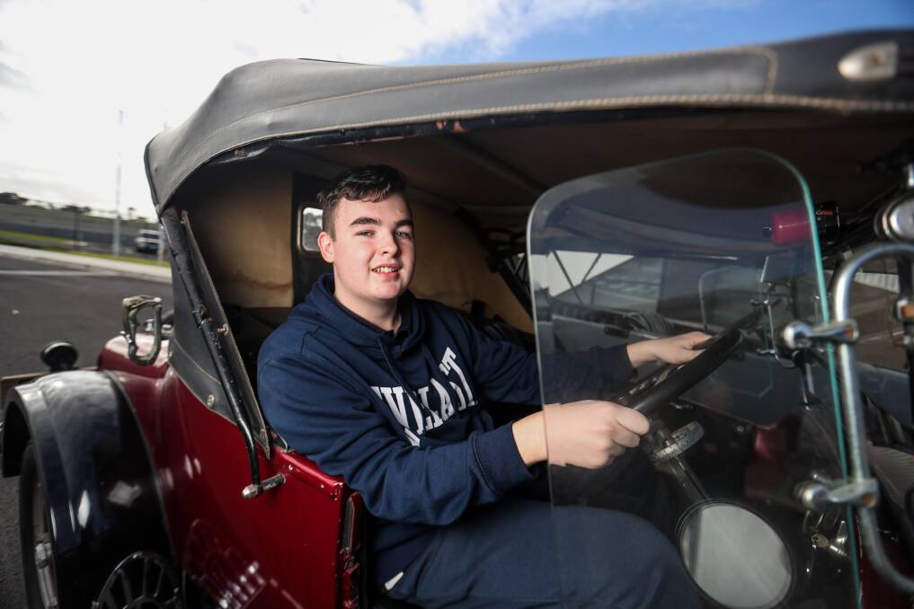 CONTROL: Merri River School student Ethan Schache in a car bought to the school for a visit from the Warrnambool and District Historical Vehicle Club. Picture: Morgan Hancock