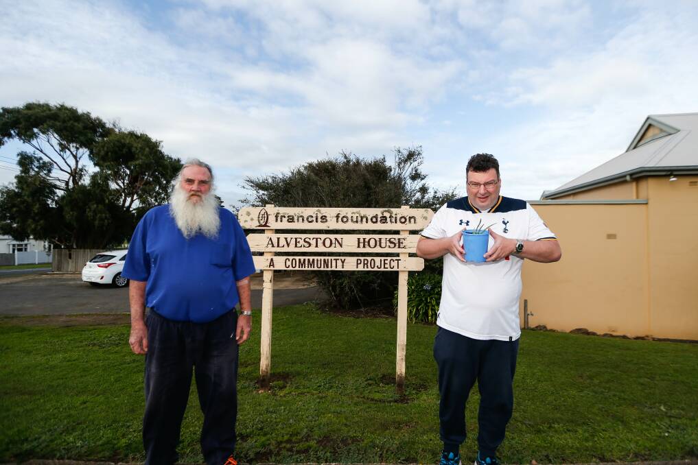 Francis Foundation Hostel volunteer Peter McMahon and resident Darren, with a pot plant . Picture: Anthony Brady