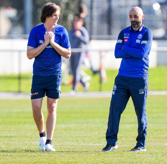 WHERE TO NOW?: Jared Polec of North Melbourne speaks to coach Rhyce Shaw at training. Picture: Morgan Hancock