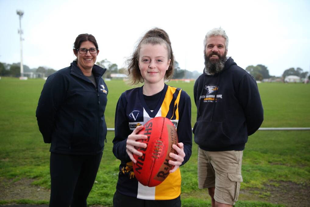 KICKING GOALS: Alexander Harris, 13, with North Warrnambool Eagles' girls academy co-coaches Tania Ross and Brad Everall. Picture: Mark Witte 