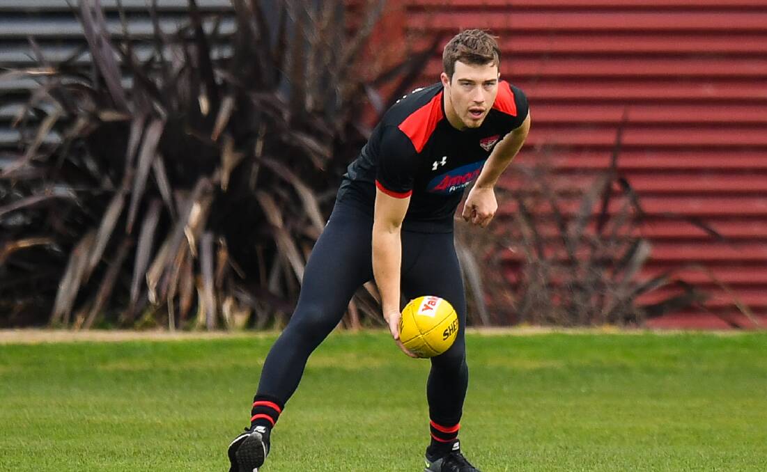 Midfielder: Essendon's Zach Merrett, a Cobden export, trains during an open training session this year. Picture: Morgan Hancock