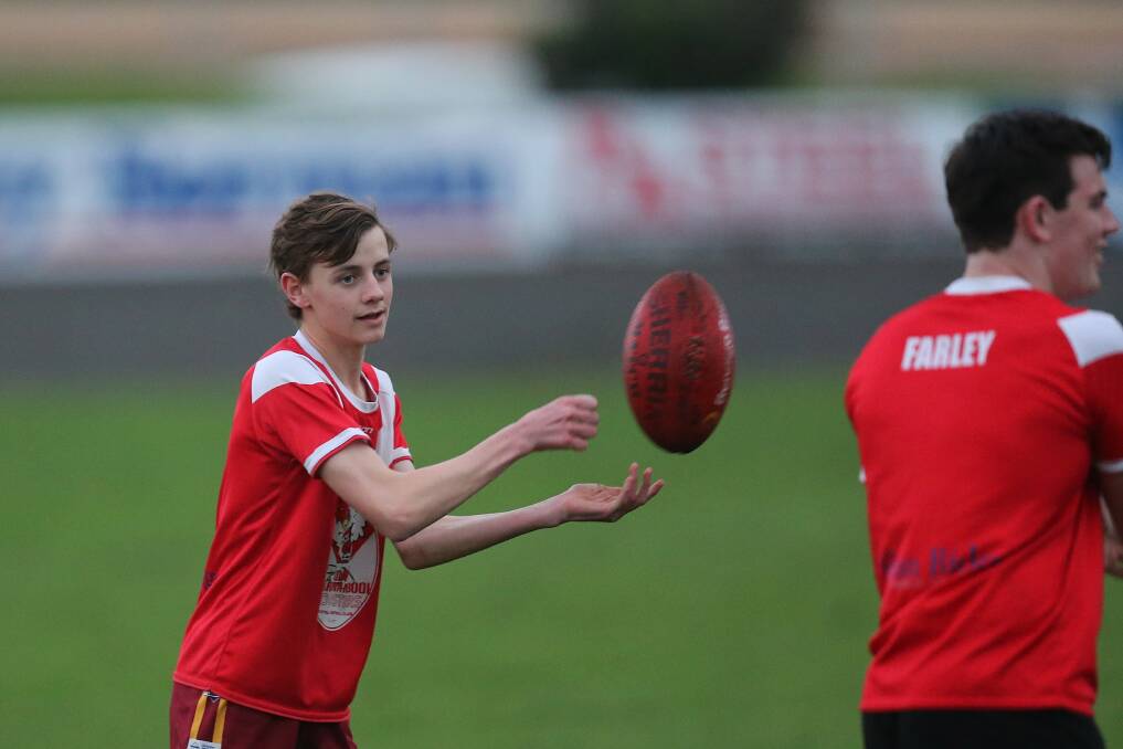 PRACTICE: South Warrnambool's Walker Owen during a handball drill at under 18 training. Picture: Mark Witte