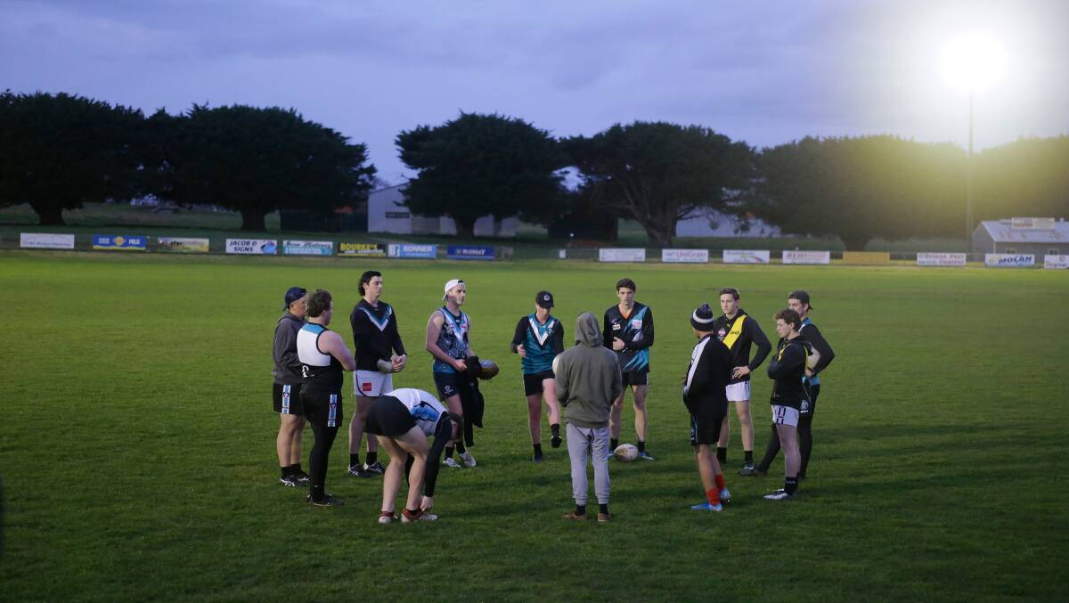 On the park: Kolora-Noorat under 18s footballers have a team meeting before training earlier this month. They may continue training despite the WDFNL season being cancelled. Picture: Mark Witte