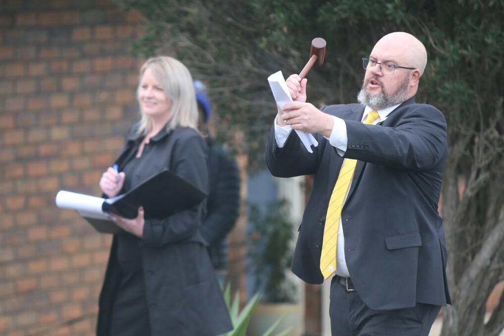 SOLD: Ray White auctioneer Jason Thwaites in action during the Membery Way auction on Saturday. Picture: Mark Witte