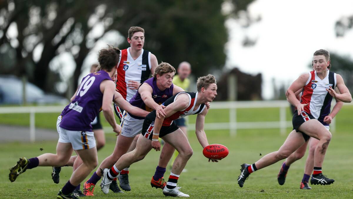 Dishing off: Koroit's Clem Nagorcka during the Koroit versus Port Fairy under 18.5s football game at Koroit. Picture: Anthony Brady