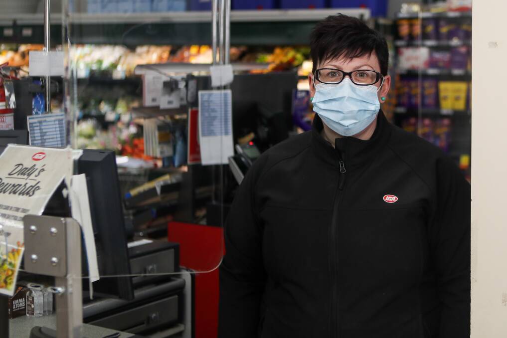 READY TO SERVE: Koroit IGA staff member Erica Clifford wears a face mask as a form of defence as COVID-19 numbers remain high in Victoria. Some employees at Port Fairy IGA are also wearing face masks. Picture: Morgan Hancock