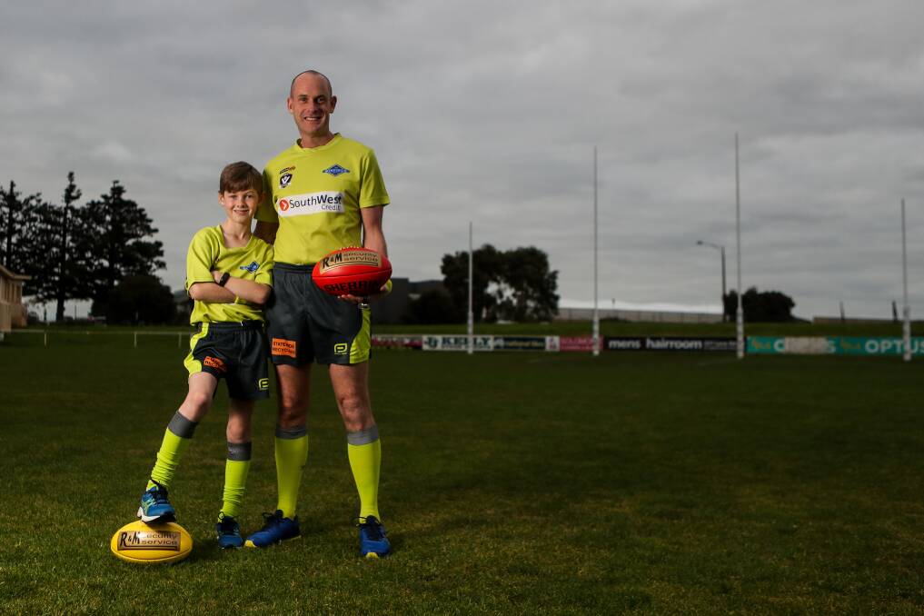KODAK MOMENT: Proud father Andrew Lougheed will umpire a Hampden league game with his son Michael, 10, for the first time on Saturday when they officiate the under 18.5 Camperdown-Cobden match. Picture: Morgan Hancock 