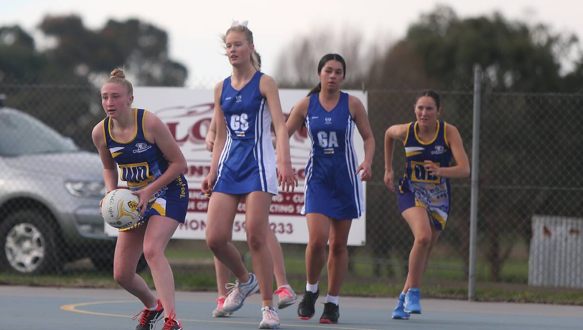 On court: North Warrnambool Eagles' Sarah Bryne looks to pass the ball during a 17 and under match between the Eagles and Hamilton Kangaroos earlier this year. Picture: Mark Witte