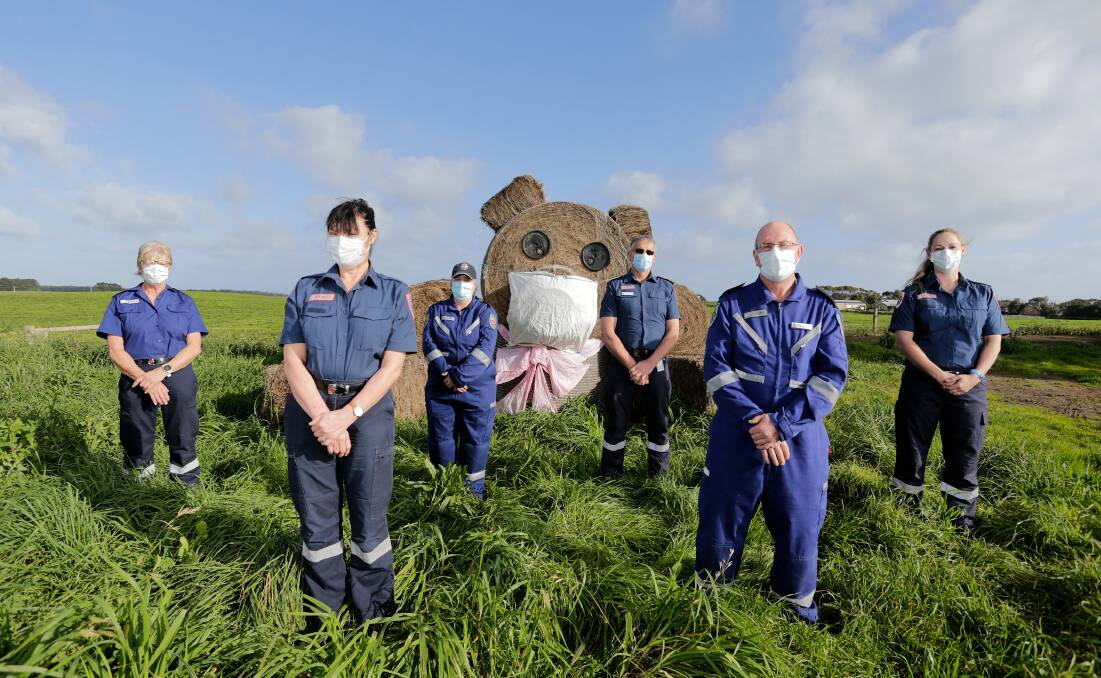 STAY SAFE: Members of the Nullawarre CERT team, including Andrea Vallance, with the haybale bear. Picture: Mark Witte
