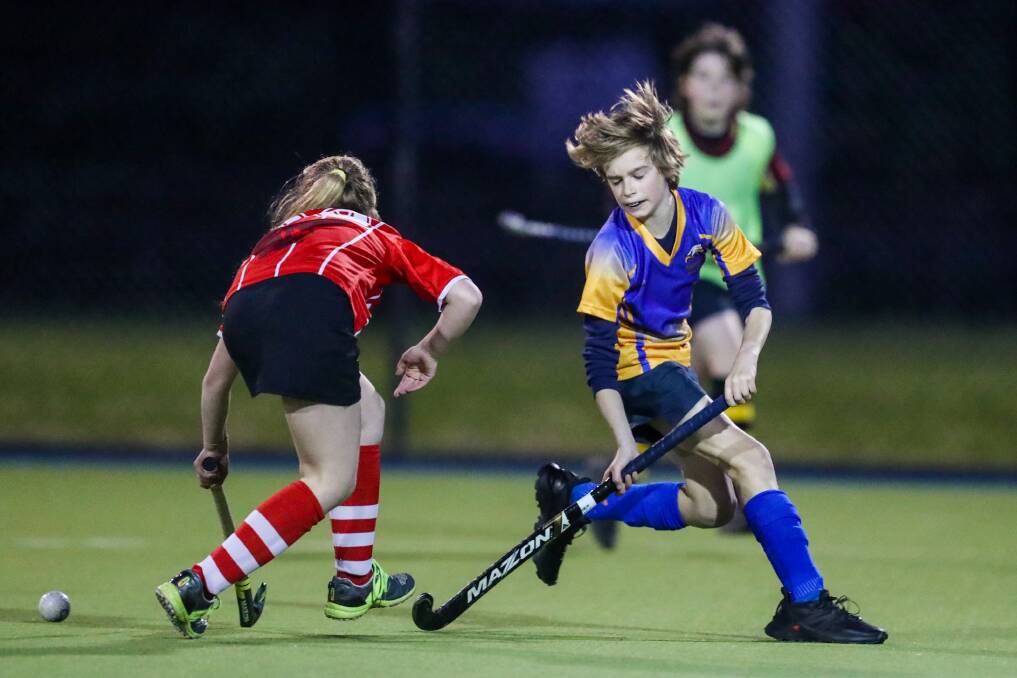 FRIDAY NIGHT LIGHTS: Techtonics' Jake Pickett on the move in a Warrnambool and District Hockey Association under 14 match. Picture: Morgan Hancock