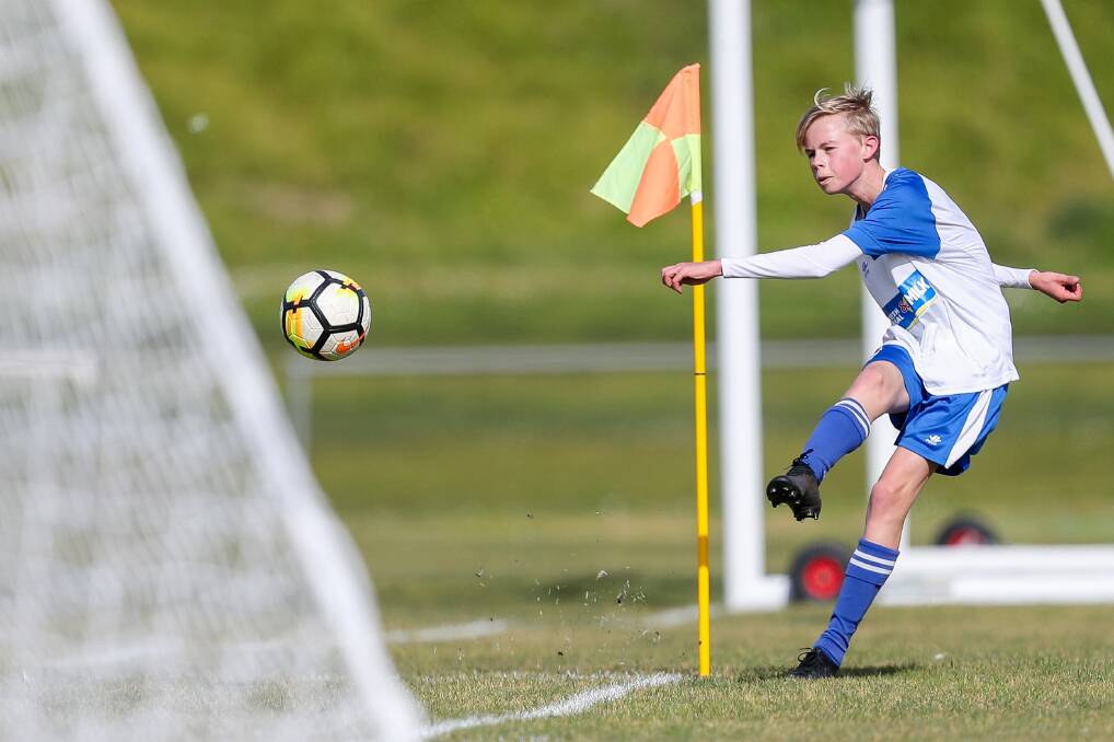 A KICK WITH MATES: Asher Kelden takes a corner kick for Warrnambool Rangers' under 17 side on Sunday. Picture: Morgan Hancock