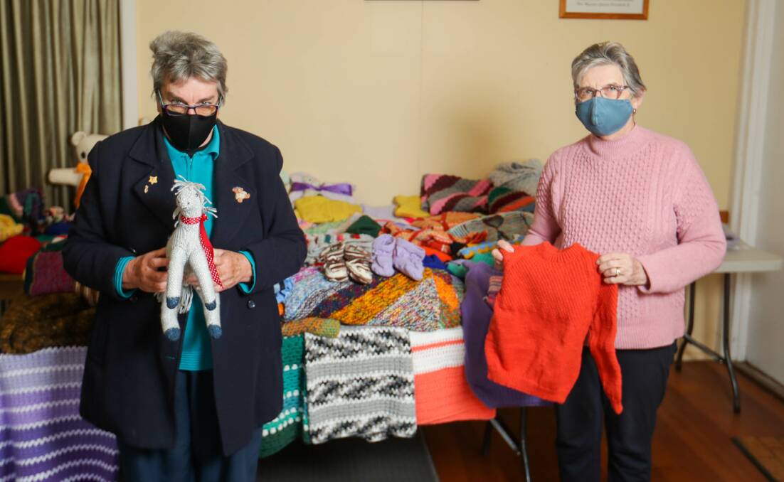 Team effort: South Warrnambool Presbyterian Church president Wendy Allan and secretary Jean Burley with the knitted and sewn items. Picture: Morgan Hancock