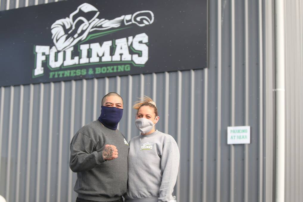 NEW HOME: Folima's Boxing and Fitness owners Chris and Alison Folima outside their new gym. The couple have to shut their new gym due to regional Victoria re-entering stage three restrictions. Picture: Mark Witte