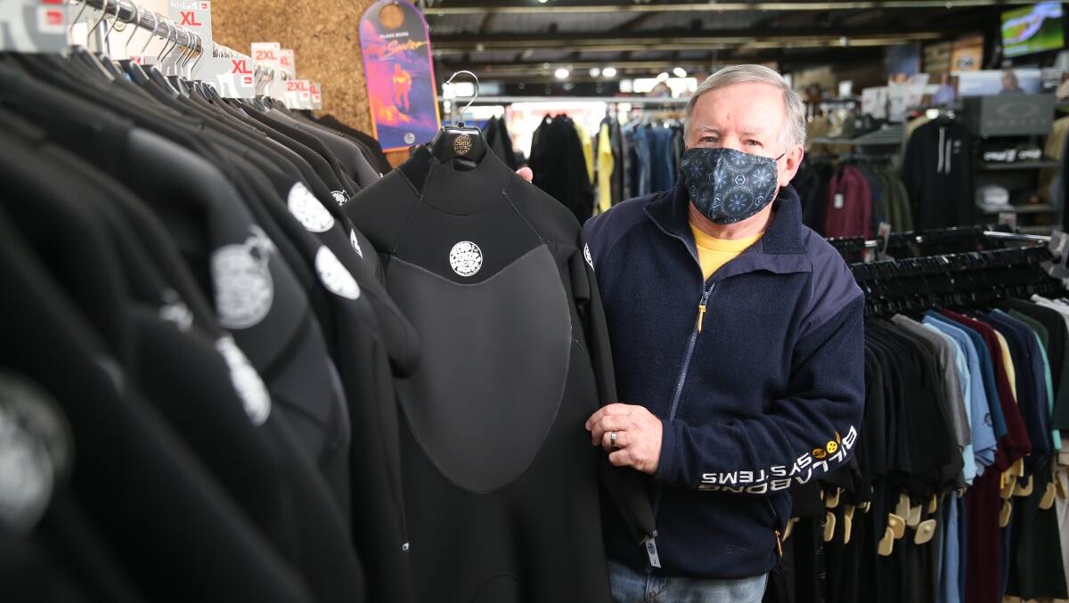 DIVING IN:Taylor's Surfodesy owner Max Taylor shows off a wetsuit. They have been one of the store's most popular sales during the coronavirus pandemic. Picture: Mark Witte