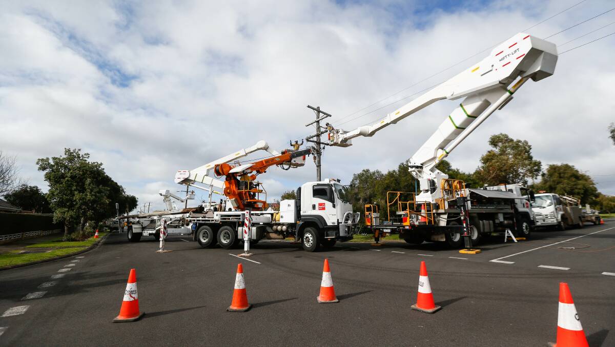 TEAM WORK: Two Powercor trucks at work in Nelson Street, Warrnambool. Picture: Anthony Brady