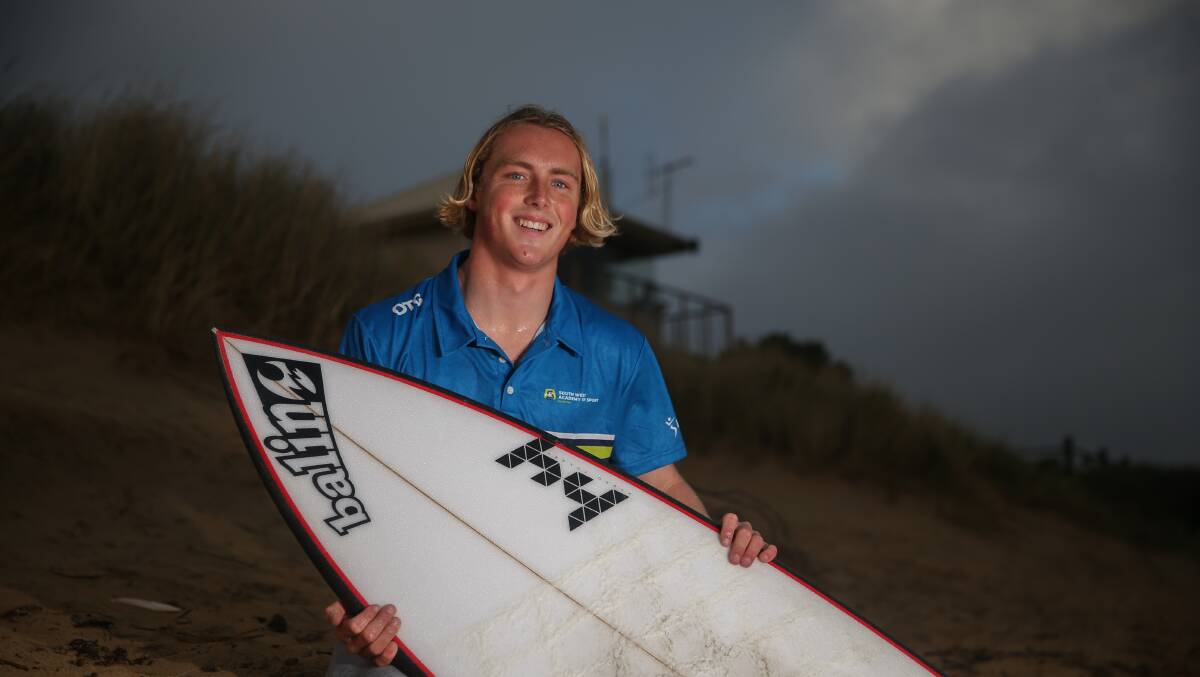 Home beach: Balun Cumming has been hitting the surf as much as he can this year. Here he is by the Warrnambool Surf Lifesaving Club. Picture: Mark Witte 