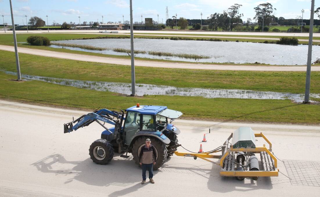 On track: Terang Harness Racing Club curator Allan Driscoll with his tractor and conditioner attached. Picture: Mark Witte