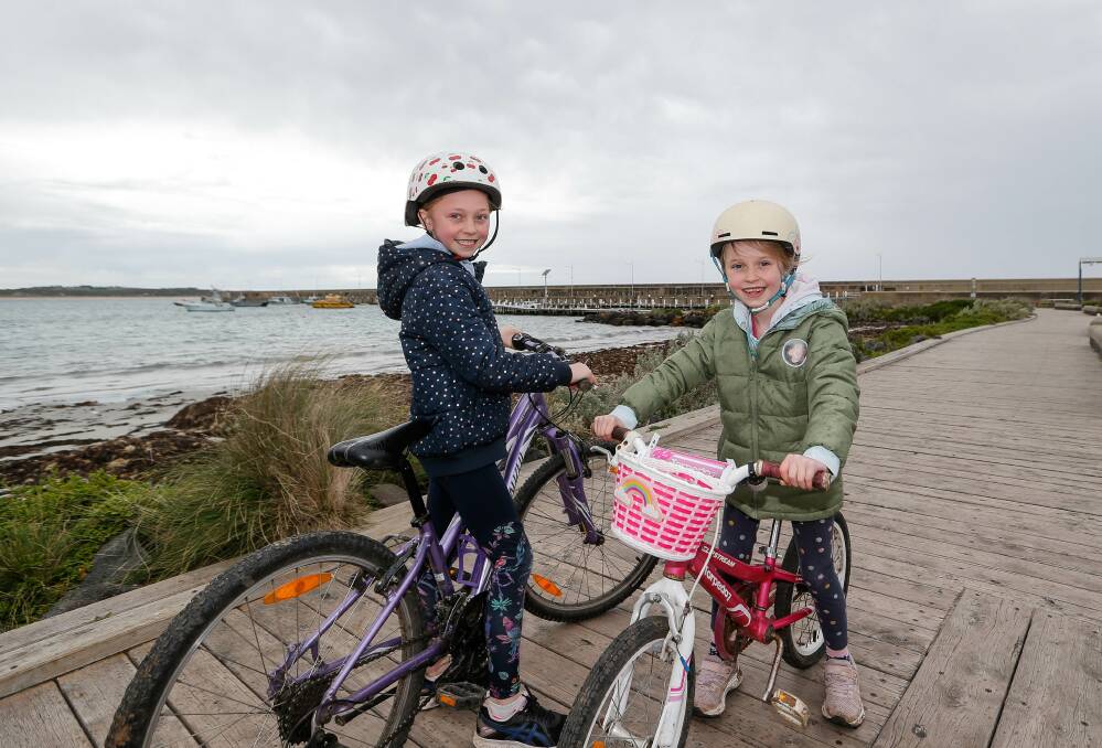 Having fun: St Thomas' Primary students Tiah Moloney, 9, and Isabel Moloney, 7, are participating in a region-wide virtual duathlon. Picture: Anthony Brady