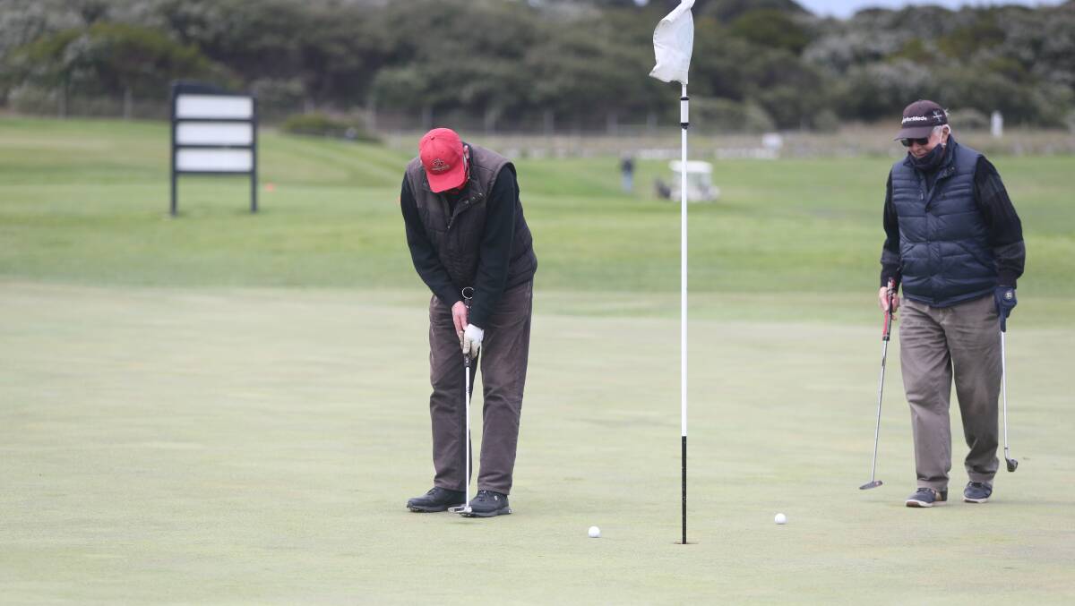 With care: Warrnambool's Norm Thwaites putts on the ninth hole at Warrnambool Golf Course on Thursday. Picture: Mark Witte