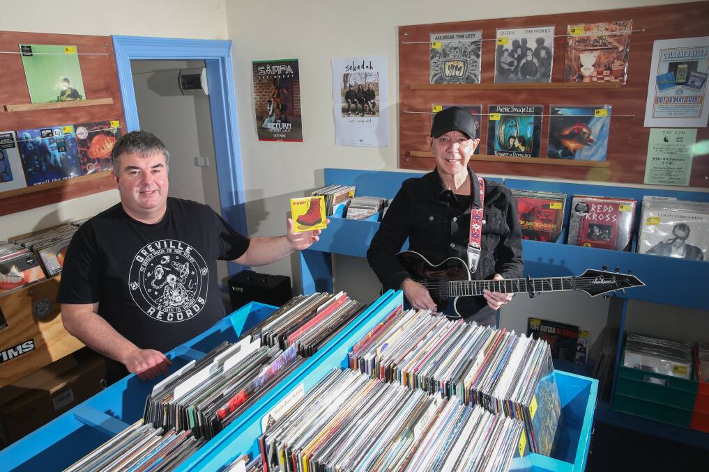 Prehistoric Sounds owner Shane Godfrey with musician Anton Cleary on Record Store Day. Picture: Mark Witte