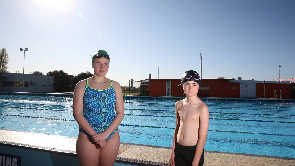 BACK IN THE WATER: Claudia White and Kai Moloney jumped back into training on Monday. Picture: Mark Witte