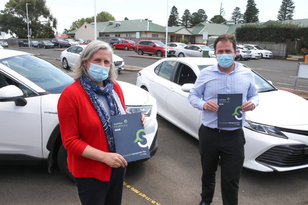 Environmental sustainability officer Elvira Hewson and service development executive director Jamie Brennan with the Environmental Management Plan. Picture: Mark Witte