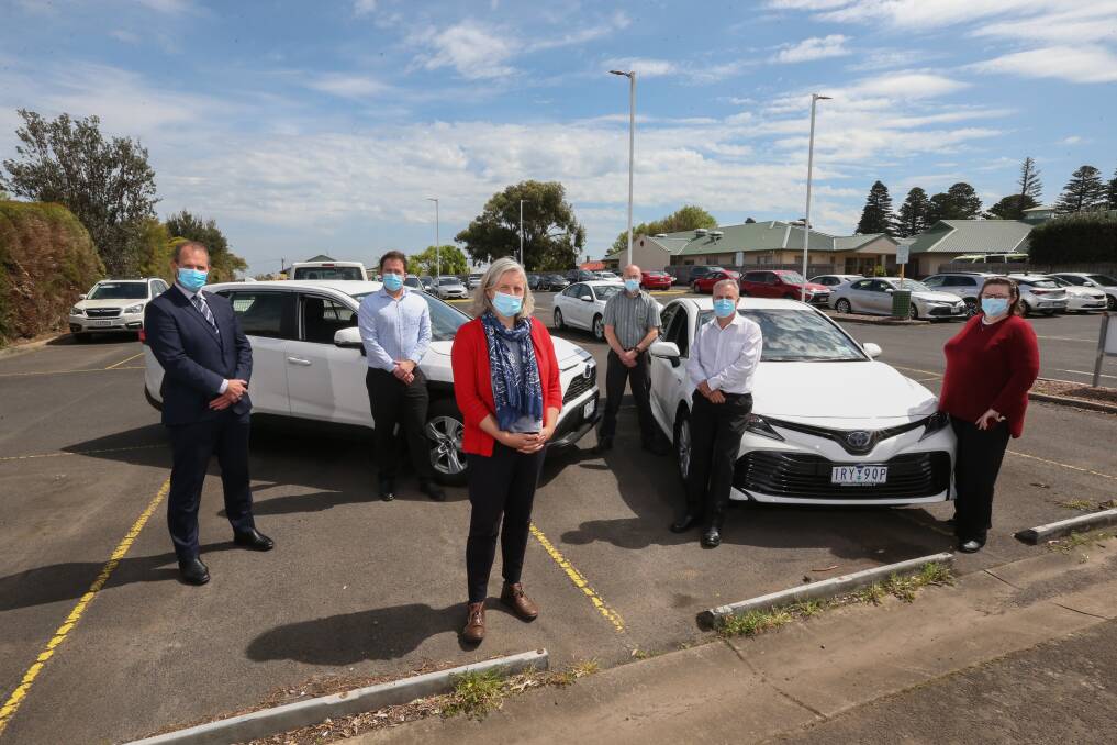 South West Healthcare staff in front of two of the new hybrid cars at SWH. Picture: Mark Witte