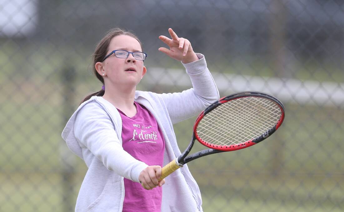 Serving: Warrnambool's Jasmine Phillips, 11, during her section five match at Warrnambool Lawn Tennis Club this past fortnight. Picture: Mark Witte