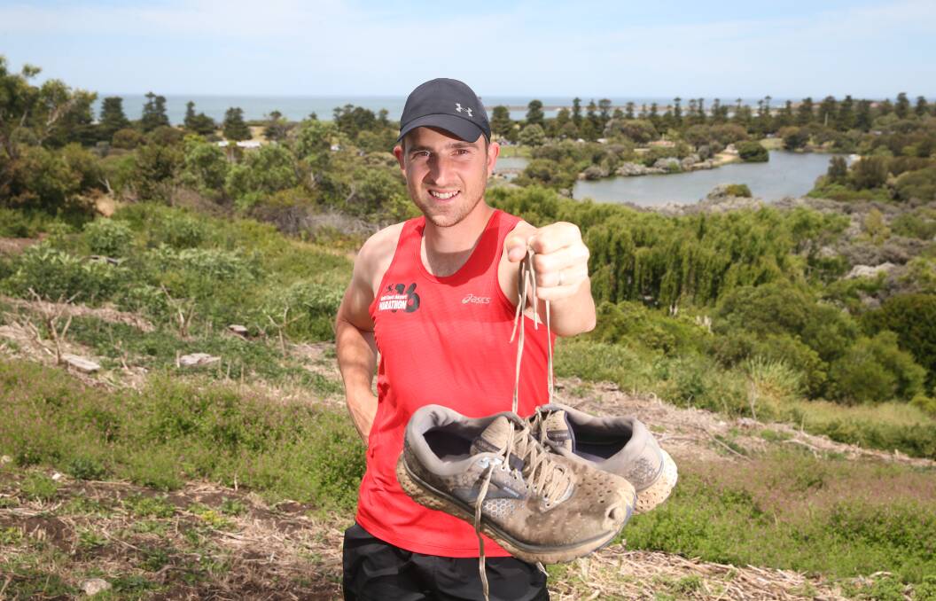 DONE AND DUSTED: Allansfords' Steve Aberline shows off the shoes he ran over 500ks in October. He says a new pair will be his reward for completing the feat. Picture: Mark Witte